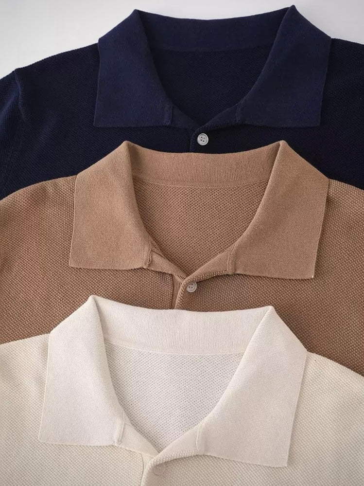 Three different colored polo shirts with collars displayed on a white background.