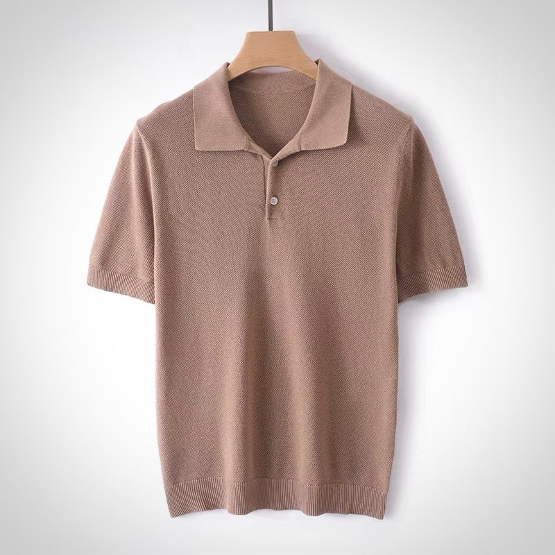 Brown polo shirt on a hanger against a white background